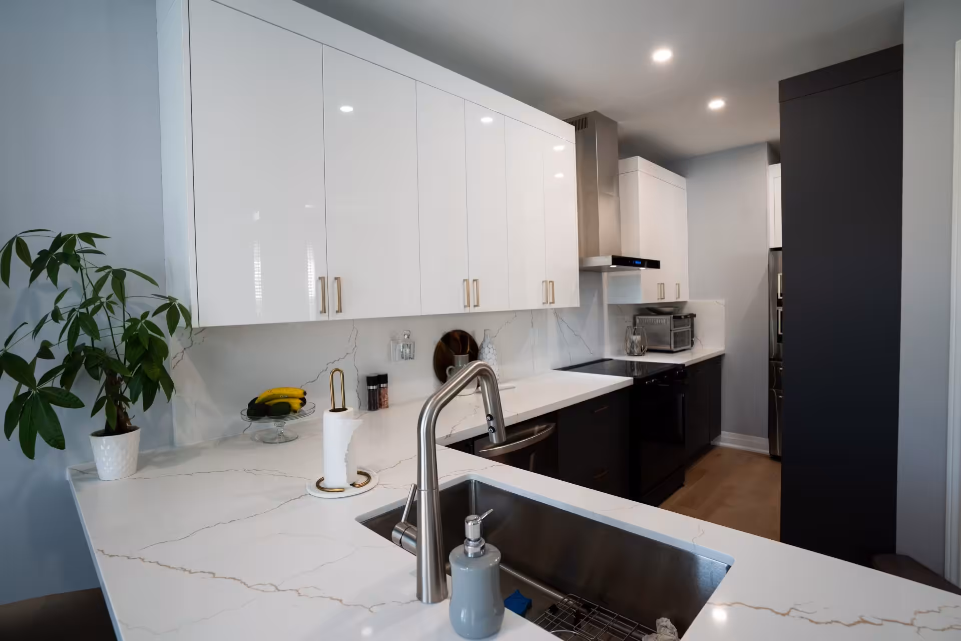 Modern white kitchen with handleless cabinets
