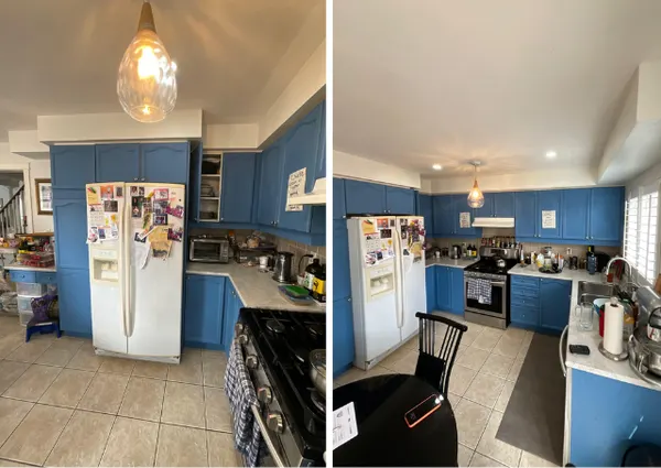Kitchen with blue-painted cabinets and dated fittings
